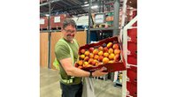 David Long with a box of apples